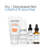 Complete skincare routine for dry and dehydrated skin, featuring SPF 50 sunscreen, intensive moisturiser, vitamin B5 gel, and vitamin C + E serum.